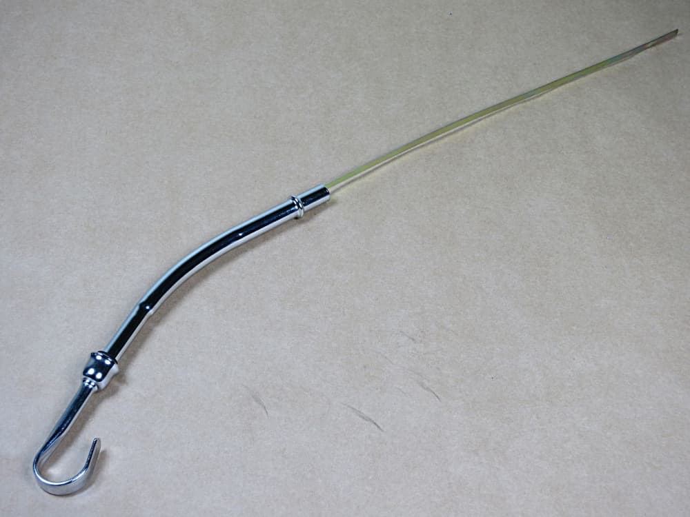 Sats med oljesticka och rör